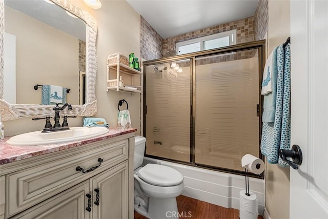 20072 Mural Cir, Huntington Beach, CA 92646 - full bath with vanity, bath / shower combo with glass door, and wood finished floors
