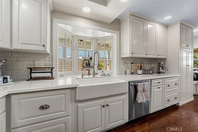 20072 Mural Cir, Huntington Beach, CA 92646 - kitchen featuring stainless steel dishwasher, dark wood-type flooring, recessed lighting, tasteful backsplash, and white cabinets