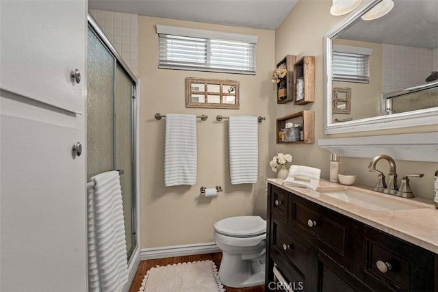 20072 Mural Cir, Huntington Beach, CA 92646 - bathroom with an enclosed shower, vanity, and wood finished floors