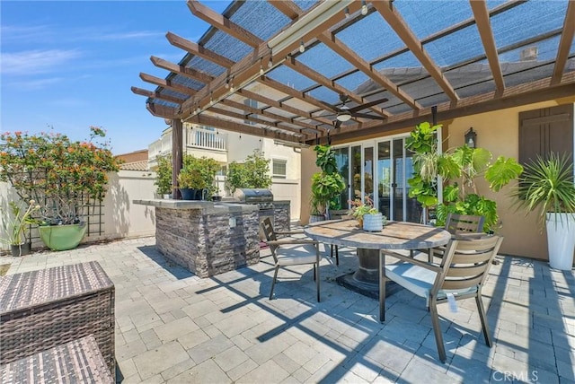 40569 Koa Ct, Temecula, CA 92591 - view of patio featuring an outdoor kitchen, a pergola, and outdoor dining space