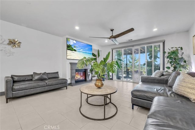 40569 Koa Ct, Temecula, CA 92591 - living room featuring a ceiling fan, a glass covered fireplace, recessed lighting, and light tile patterned flooring
