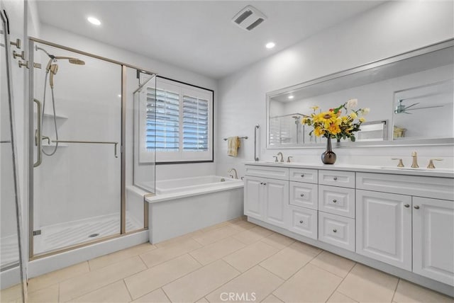40569 Koa Ct, Temecula, CA 92591 - bathroom featuring double vanity, a bath, a stall shower, recessed lighting, and tile patterned flooring