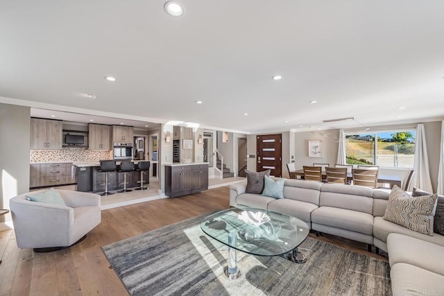 3526 Ticonderoga St, San Diego, CA 92117 - living area featuring light wood-style flooring, recessed lighting, and stairway