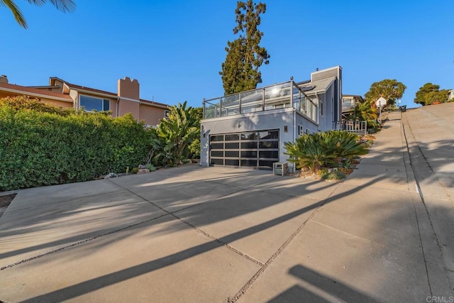 3526 Ticonderoga St, San Diego, CA 92117 - view of front facade featuring concrete driveway, stucco siding, and a garage