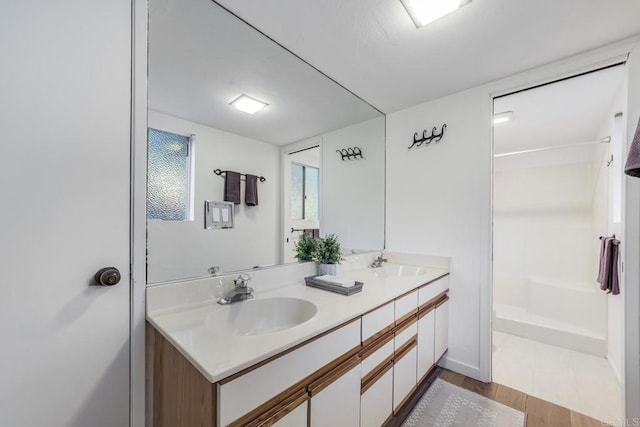 3526 Ticonderoga St, San Diego, CA 92117 - full bathroom with double vanity and wood finished floors