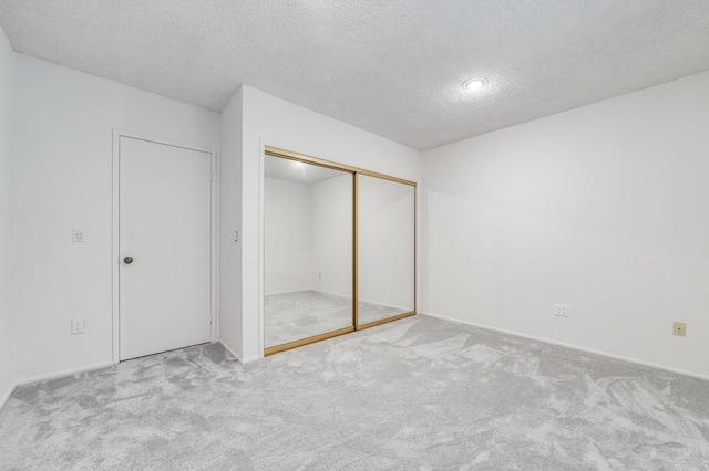 3526 Ticonderoga St, San Diego, CA 92117 - unfurnished bedroom featuring carpet flooring, a textured ceiling, and a closet