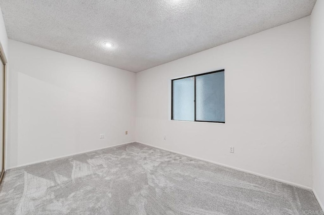 3526 Ticonderoga St, San Diego, CA 92117 - carpeted empty room featuring a textured ceiling and baseboards