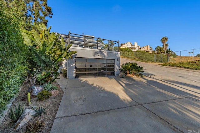 3526 Ticonderoga St, San Diego, CA 92117 - back of property featuring concrete driveway, an attached garage, and stucco siding