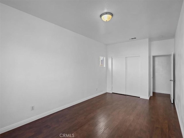 37453 56th St E, Palmdale, CA 93552 - unfurnished bedroom featuring wood finished floors and a closet