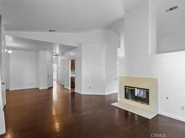 37453 56th St E, Palmdale, CA 93552 - unfurnished living room featuring wood finished floors, vaulted ceiling, and a premium fireplace