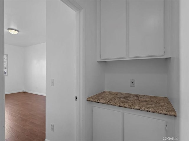 37453 56th St E, Palmdale, CA 93552 - kitchen featuring wood finished floors, white cabinetry, and light stone countertops