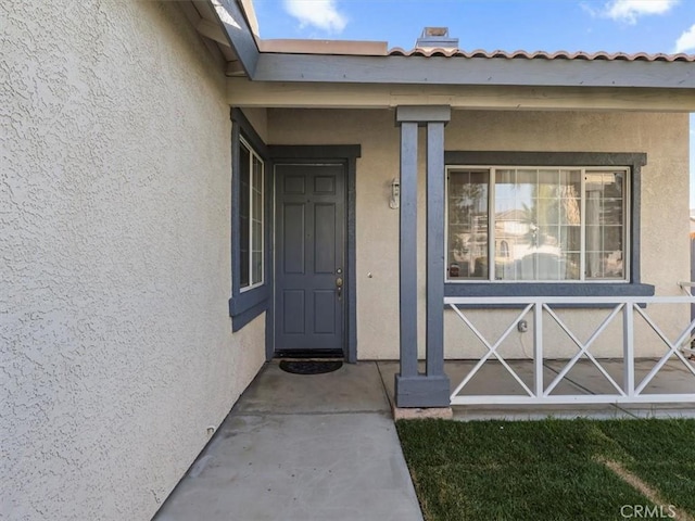 37453 56th St E, Palmdale, CA 93552 - doorway to property featuring stucco siding