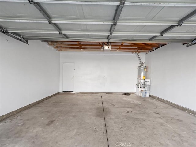 37453 56th St E, Palmdale, CA 93552 - garage featuring a garage door opener and water heater