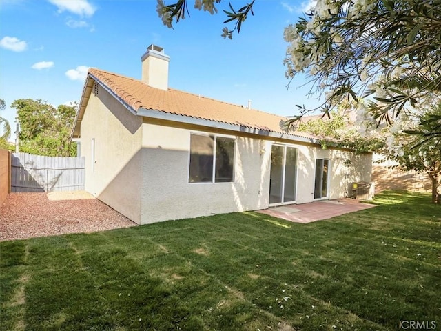 37453 56th St E, Palmdale, CA 93552 - back of house with stucco siding, a chimney, a tile roof, and a patio area