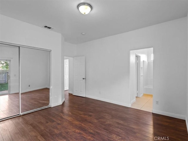 37453 56th St E, Palmdale, CA 93552 - unfurnished bedroom featuring wood finished floors, a closet, and ensuite bath