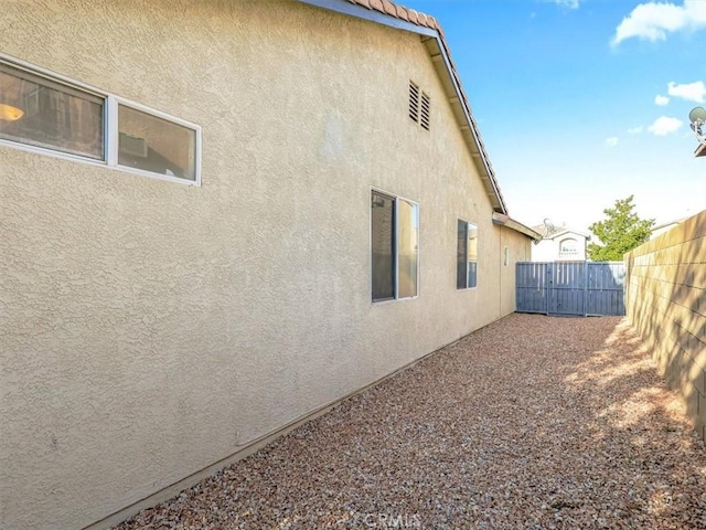 37453 56th St E, Palmdale, CA 93552 - view of home's exterior with stucco siding