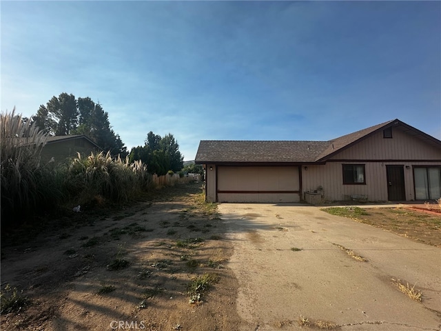 30001 Caddy Ln, Tehachapi, CA 93561 - view of front of home featuring concrete driveway and an attached garage