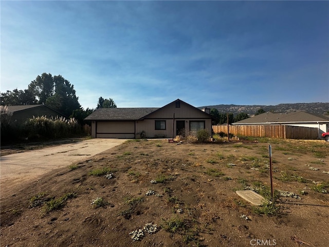 30001 Caddy Ln, Tehachapi, CA 93561 - view of front of house featuring an attached garage, driveway, and an outdoor structure
