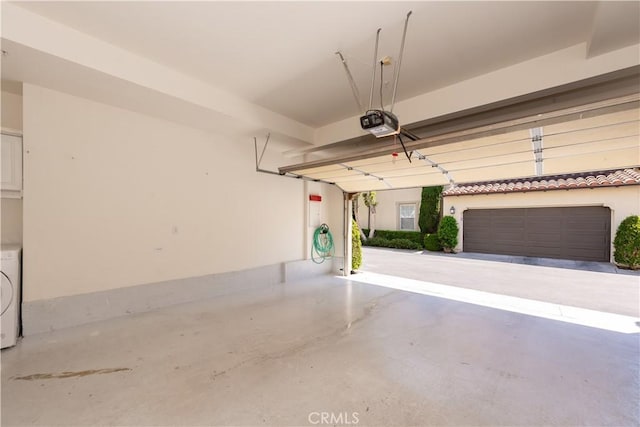 23 Bower Tree, Irvine, CA 92603 - garage featuring washer / clothes dryer and a garage door opener