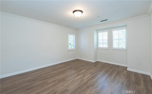 23 Bower Tree, Irvine, CA 92603 - unfurnished room with dark wood-type flooring and ornamental molding