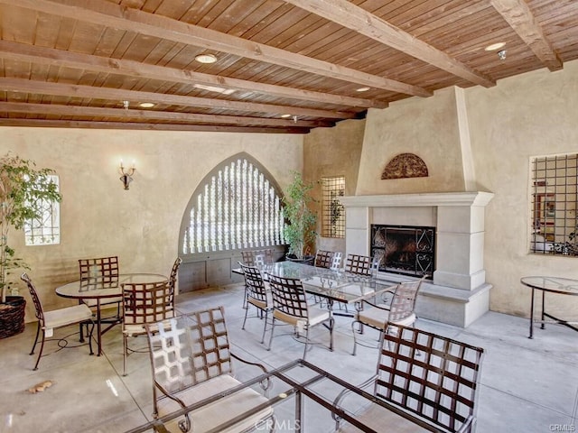 23 Bower Tree, Irvine, CA 92603 - view of patio featuring a fireplace with raised hearth and outdoor dining space