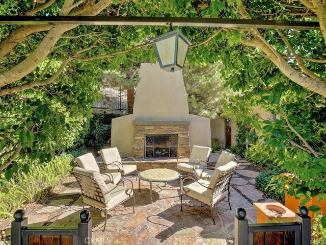 23 Bower Tree, Irvine, CA 92603 - view of patio with an outdoor stone fireplace