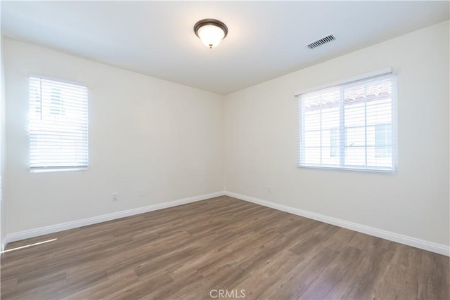 23 Bower Tree, Irvine, CA 92603 - unfurnished room featuring wood finished floors and healthy amount of natural light