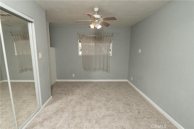 906 E 22nd St, Merced, CA 95340 - unfurnished bedroom with carpet, a closet, and ceiling fan
