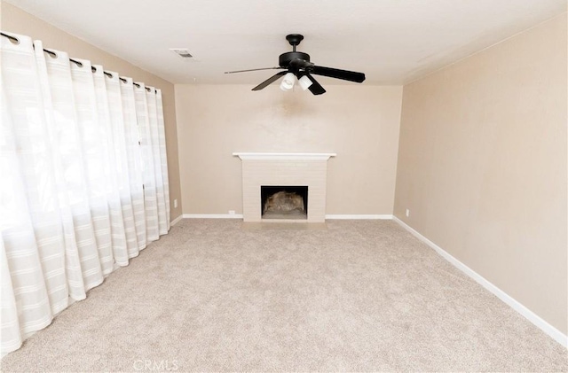 906 E 22nd St, Merced, CA 95340 - unfurnished living room featuring ceiling fan, carpet flooring, and a fireplace with flush hearth