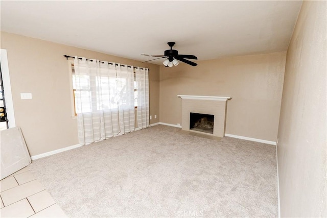 906 E 22nd St, Merced, CA 95340 - unfurnished living room featuring a ceiling fan, a fireplace, and carpet flooring