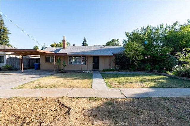 906 E 22nd St, Merced, CA 95340 - view of front of property featuring an attached carport, a chimney, concrete driveway, and stucco siding