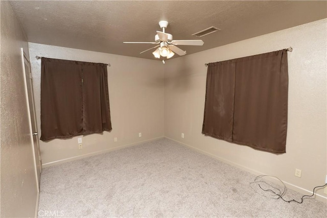 906 E 22nd St, Merced, CA 95340 - spare room featuring carpet flooring, ceiling fan, and a textured ceiling