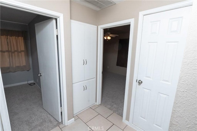 906 E 22nd St, Merced, CA 95340 - corridor featuring light colored carpet and baseboards