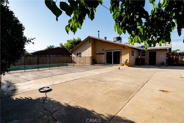906 E 22nd St, Merced, CA 95340 - view of front of house with stucco siding and a patio area