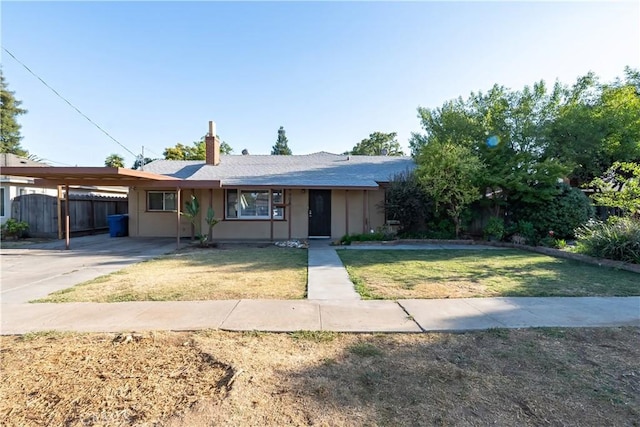 906 E 22nd St, Merced, CA 95340 - view of front facade featuring a carport, a chimney, and driveway