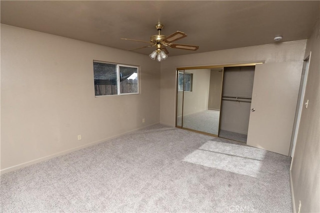 906 E 22nd St, Merced, CA 95340 - unfurnished bedroom with carpet floors, a closet, and a ceiling fan