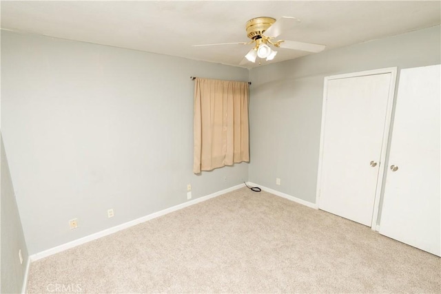 906 E 22nd St, Merced, CA 95340 - unfurnished bedroom with light carpet and a ceiling fan