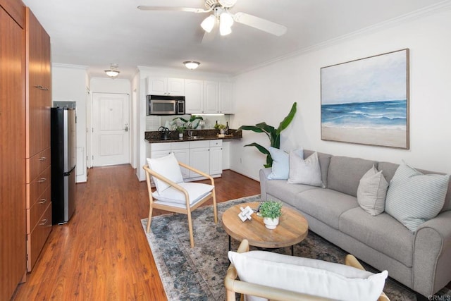 1021 Scott St Unit 130, Point Loma, CA 92106 - living area with wood finished floors, crown molding, and a ceiling fan