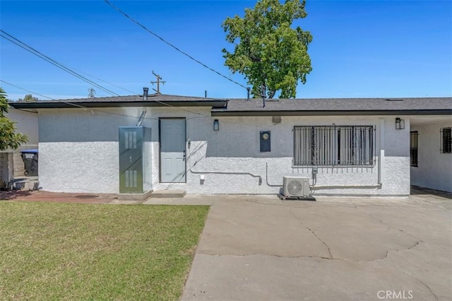 501 W Floral Dr, Monterey Park, CA 91754 - rear view of property featuring stucco siding and a yard