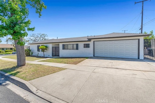 501 W Floral Dr, Monterey Park, CA 91754 - single story home featuring stucco siding, driveway, and an attached garage