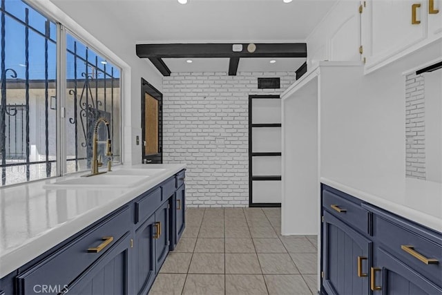 501 W Floral Dr, Monterey Park, CA 91754 - bathroom with brick wall, recessed lighting, vanity, beam ceiling, and tile patterned floors