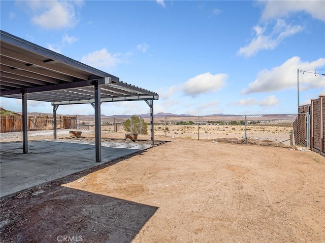 1233 Cabrillo Dr, Barstow, CA 92311 - view of yard featuring a patio and a mountain view