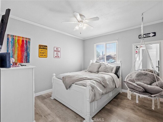 1233 Cabrillo Dr, Barstow, CA 92311 - bedroom featuring ornamental molding, light wood finished floors, and ceiling fan