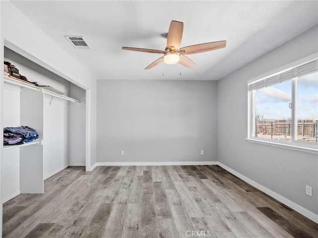 1233 Cabrillo Dr, Barstow, CA 92311 - unfurnished bedroom with wood finished floors, a closet, and ceiling fan
