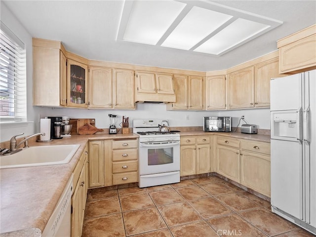 1233 Cabrillo Dr, Barstow, CA 92311 - kitchen with white appliances, light brown cabinets, and light countertops