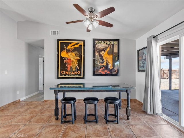 1233 Cabrillo Dr, Barstow, CA 92311 - dining area with lofted ceiling, ceiling fan, and light tile patterned floors