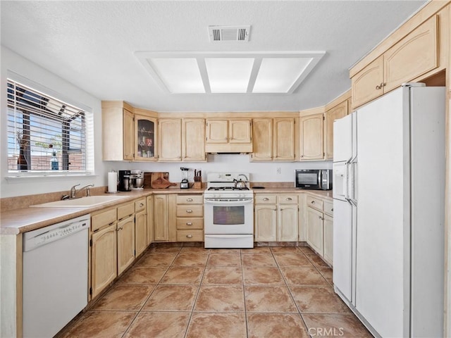 1233 Cabrillo Dr, Barstow, CA 92311 - kitchen with white appliances, light brown cabinets, and under cabinet range hood