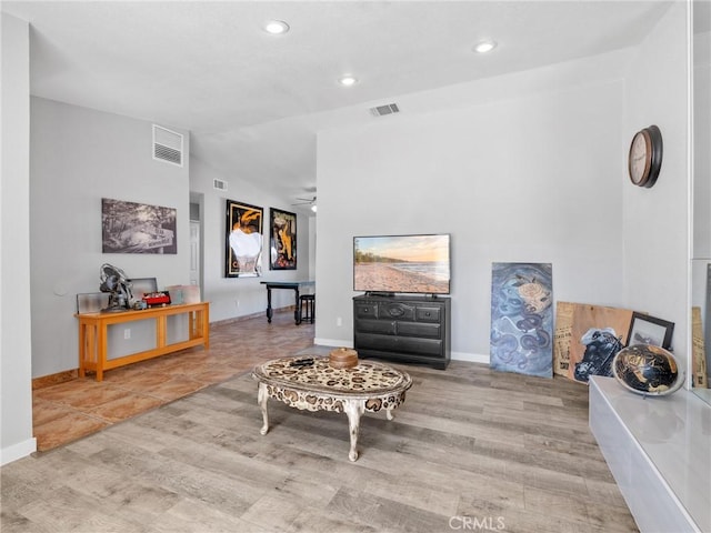 1233 Cabrillo Dr, Barstow, CA 92311 - living room with vaulted ceiling, wood finished floors, recessed lighting, and a ceiling fan