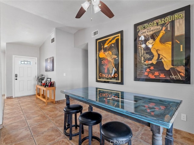 1233 Cabrillo Dr, Barstow, CA 92311 - dining room featuring tile patterned flooring, lofted ceiling, and a ceiling fan