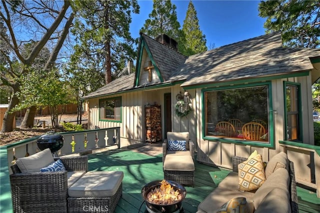 292 Heliotrope Dr, Lake Arrowhead, CA 92352 - wooden terrace featuring an outdoor living space with a fire pit